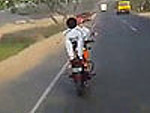 Motorcyclist Is Multitasking His Commute
