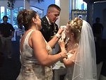 Newly Married Couple Get Carried Away Doing The Cake Thing
