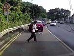 Old Lady Trips Whilst Crossing The Road

