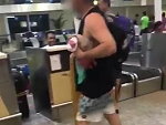 Passenger Checking In His Luggage At Bali's Denpasar Airport
