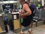 Passenger Checking In His Luggage At Bali's Denpasar Airport
