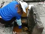 People Collect Discarded Oil From The Sewer For Reuse In China
