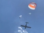 Plane Parachutes Gently To The Ground
