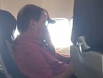 Plane Passenger Enjoying A Pick And Eat
