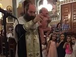 Priest Baptises A Baby Aggressively
