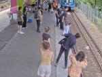 Psycho Bitch Pushes An Old Guy Onto The Tracks
