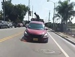 Repo Driver Maniacally Dragging A Car Around Town
