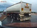 Semi Slides Out At A Roundabout In The Wet
