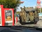 Soldiers Take Their Tank Through A Drive Thru
