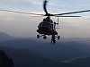 Stunning Shot Of A Helicopter Rescuing People On A Mountain