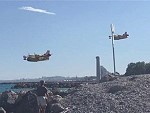 Three Water Bombers Come In To Replenish
