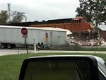 Train Destroys A Broken Down Semi Stopped On The Tracks