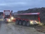 Truck Dumps More Than Its Load
