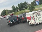 Two SUV's Get Into A Little Battle
