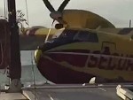 Waterbomber Clips A Houseboat Whilst Filling The Tanks
