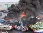 Whole Bunch Of Ships Go Up In An Indonesian Port
