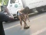 Woman Catches A Big Snake And Saves It From Being Run Over
