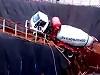 Workers Wait Patiently For The Mixer Truck To Go Over The Edge